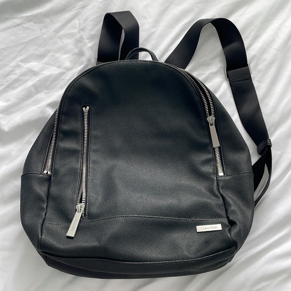 calvin klein leather backpack men's Jeans front pockets Calvin Klein Backpacks for Men